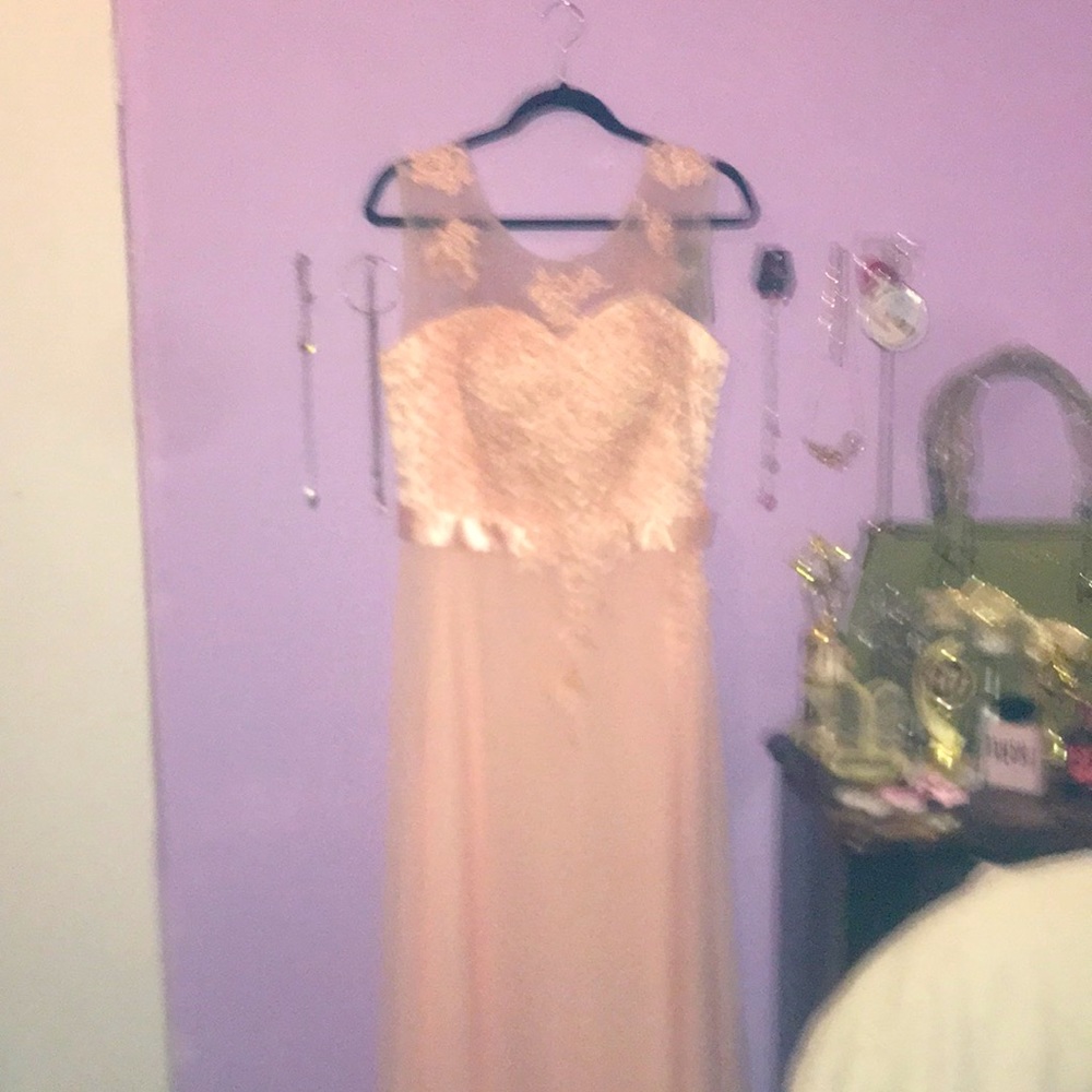I am selling this dress was never wore.